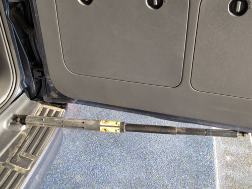The locking mechanism on the rear door of the Prado that will hold it in the open position