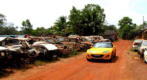 The Mazda MX-5 in amongst a heap of cars that didn't survive a trip to Cape York